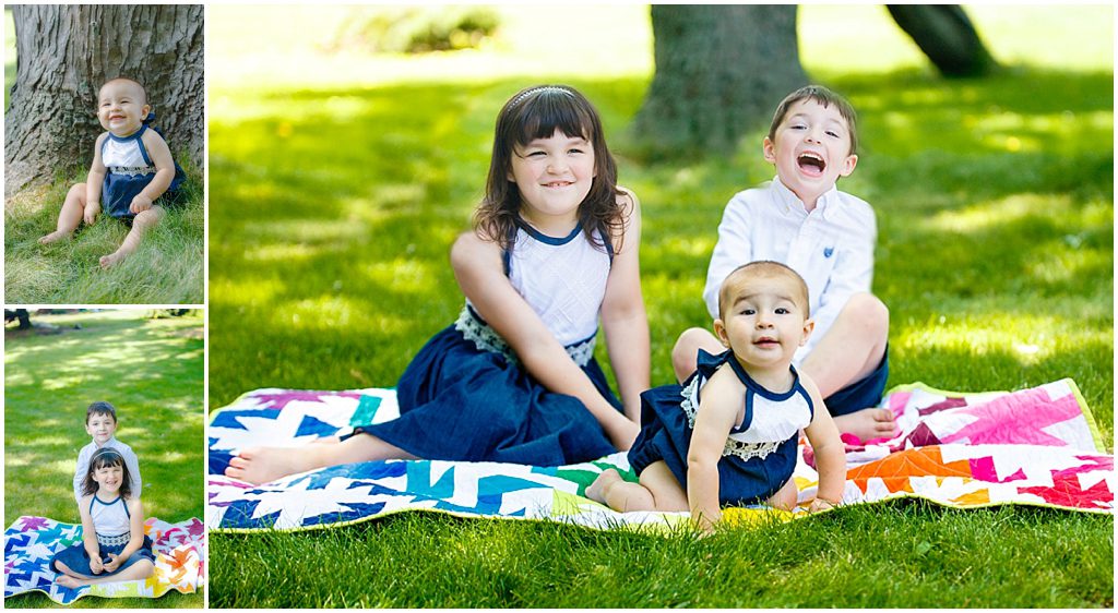Three kids sitting on handmade quilt in the grass wearing navy and white by Ristaino Photography of Sarasota FL