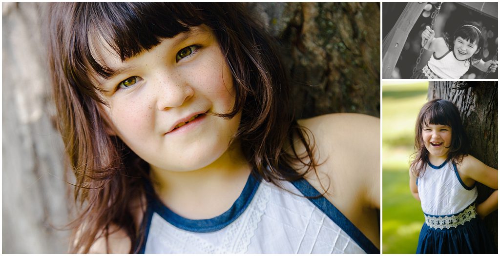 Young girl in white and navy handmade dress by Ristaino Photography of Sarasota FL