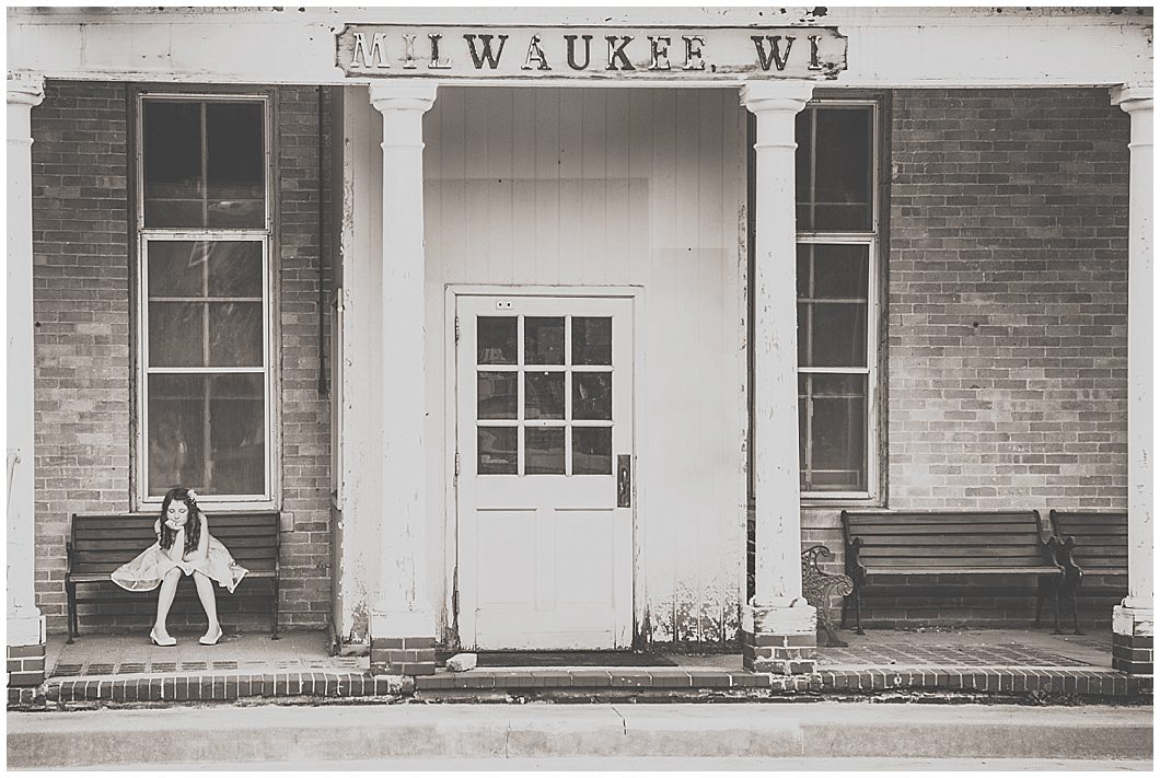 Little girl sits at old train station in Milwaukee WI during Beauty Revived session by Ristaino Photography of Sarasota FL