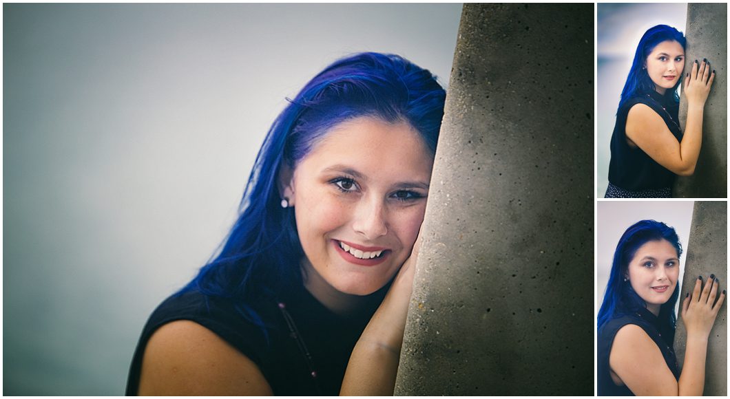 High School senior girl with blue hair poses for senior portraits in sarasota FL
