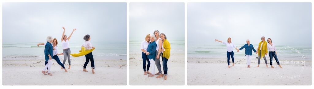 Group of women laughing, dancing, and holding hands during a playful and joyful friendship photography session on a foggy beach in Sarasota, Florida.