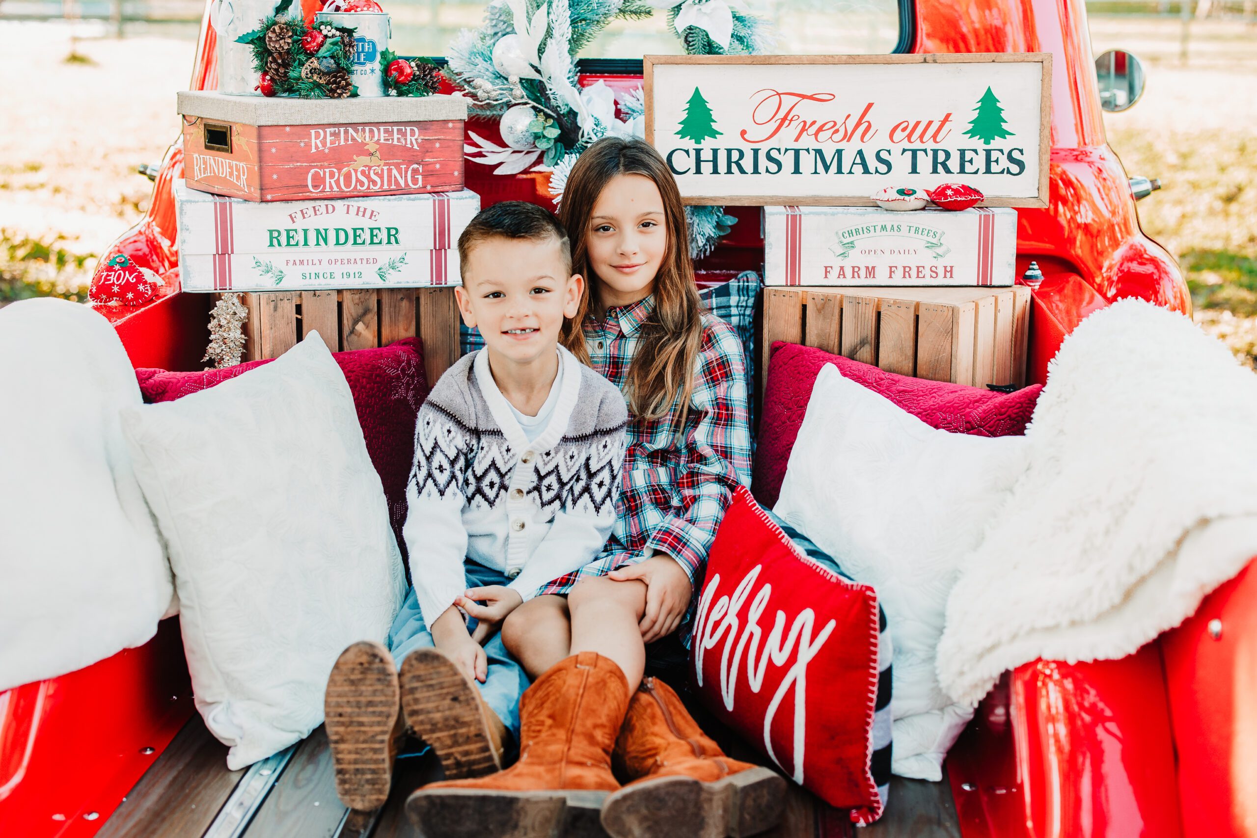Holiday decorated red truck family mini session at private ranch in Myakka