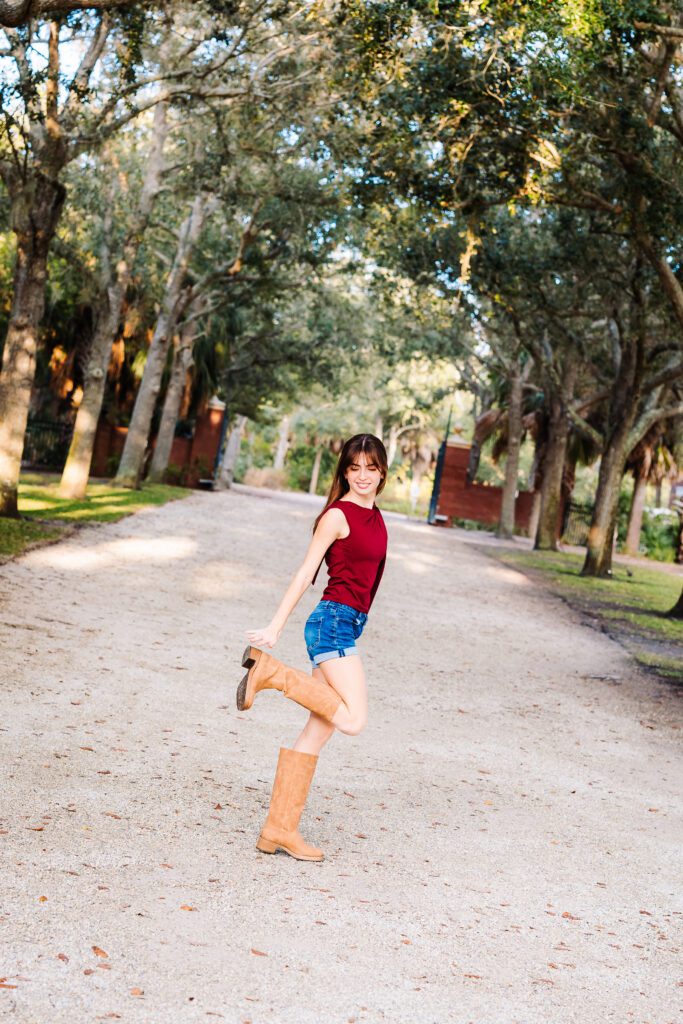 Candid senior portrait on tree-lined path, Sarasota FL