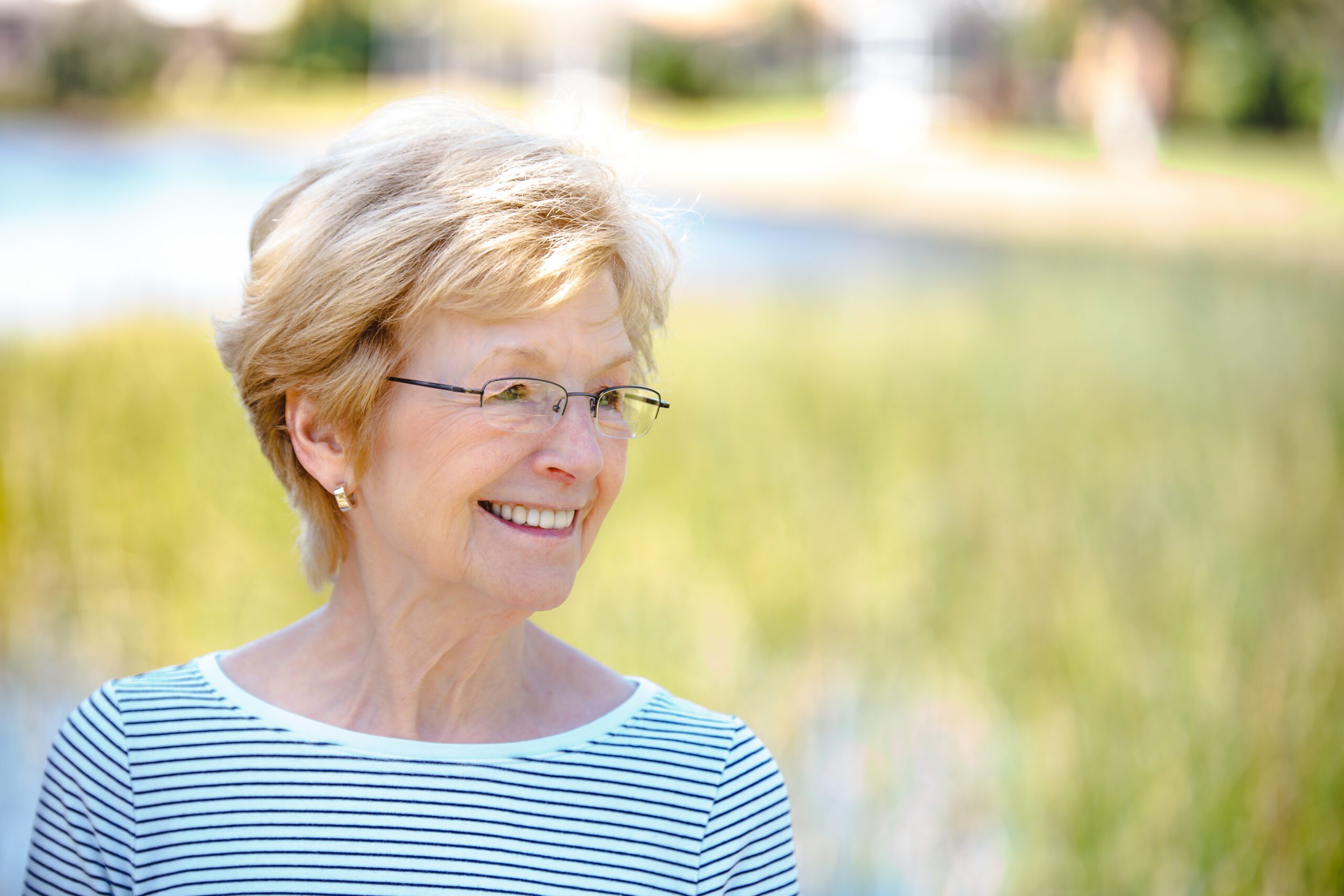 Dori Chaconas, children's book author and artist, smiling outdoors in natural light.