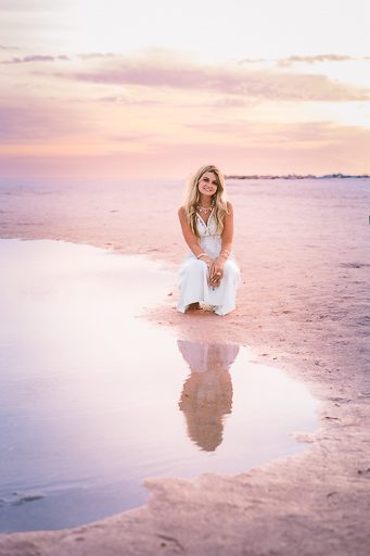 Golden hour senior portrait at the water's edge, Sarasota